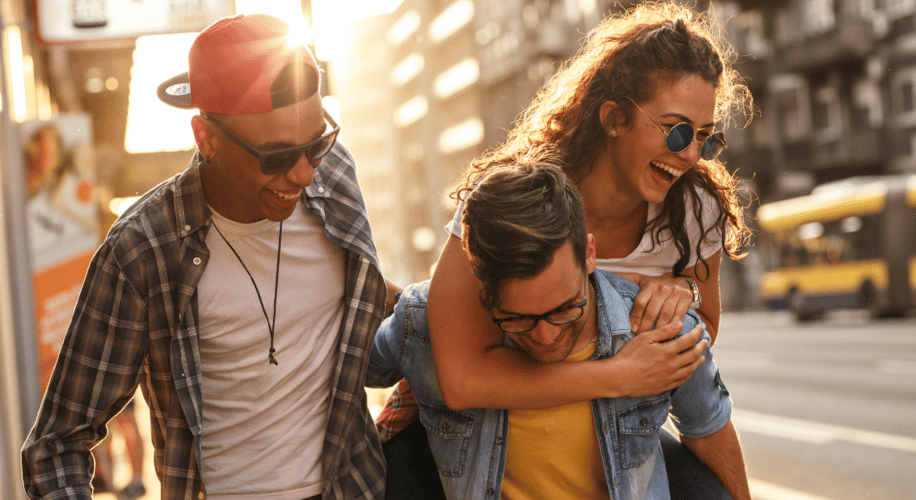 three friends laughing in the city