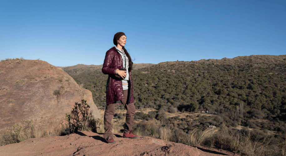 woman standing on a mountain top