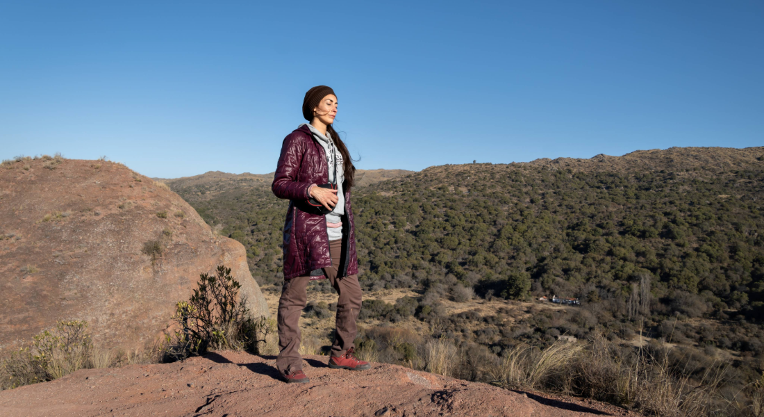 woman standing on a mountain top